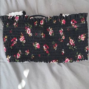 a black strapless bathing suit top w/ pink flowers
